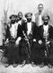 Tanzania / Zanzibar: Omani Arab men of substance with two servants, 1904